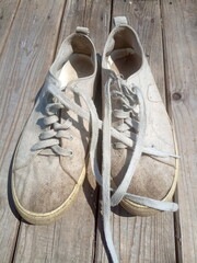 old worn out and dirty white sneakers