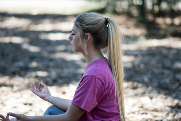 young girl practicing meditation