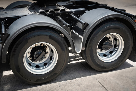 Rear of Semi Truck Wheels Tires. Rubber, Vechicle Tyres. Freight Trucks Cargo Transport. Auto Repair Service Shop. 	