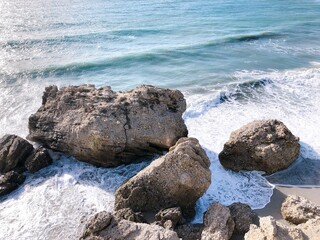 [Spain] A large rock on the shore of the beach (The Balcony of Europe, Nerja)