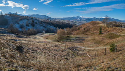 Last good weather days in autumn mountain countryside morning peaceful picturesque scene. Ukrainian Carpathians mountains in far.