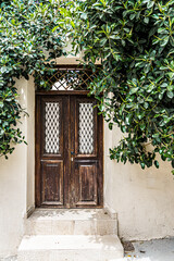 Fototapeta na wymiar Traditional greek style door in a town house on Santorini island