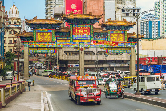 April 8, 2019: Binondo Chinatown Arch at the entrance from Jones Bridge over Pasig River. It is the largest chinatown arch of the world in manila, philippines, and was inaugurated on June 23, 2015.