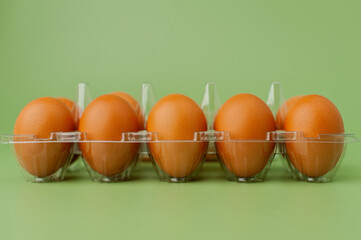 The eggs are laid out in a panel on a light green background. clean raw chicken eggs - obrazy, fototapety, plakaty