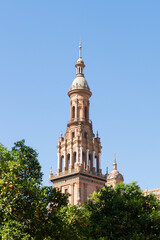 South tower of the famous Plaza de España in Seville seen from María Luisa Park. Tower designed...