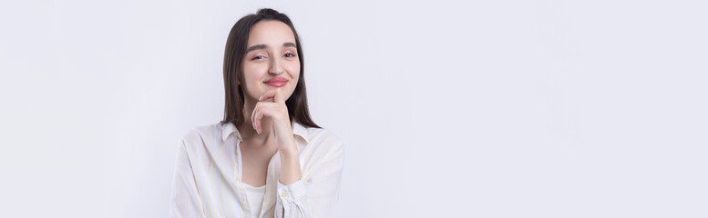 Portrait of a beautiful young woman thinking, isolated on white background