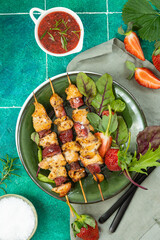 Chicken skewers with herbs and sauce