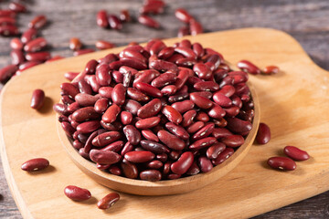 raw red kidney beans in plate on table.