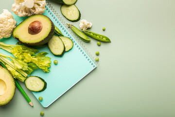 Blank notepad with ingredients for preparing tasty and healthy food