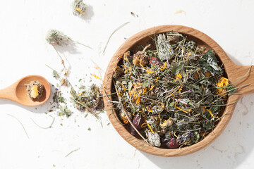 Fototapeta premium herbal tea, dried medicinal herbs on a white background, herbal medicine
