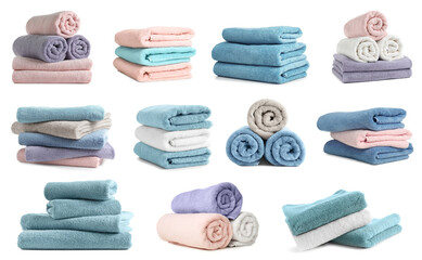 Set of folded and rolled colorful towels on white background
