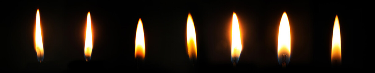 Collection of candle flames on black background. Banner design