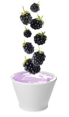 Many fresh blackberries falling into bowl of yogurt on white background