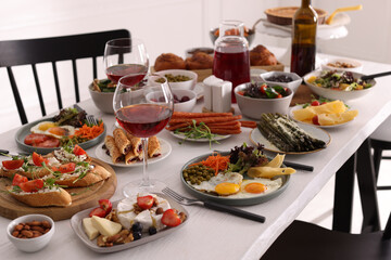 Many different dishes served on buffet table for brunch