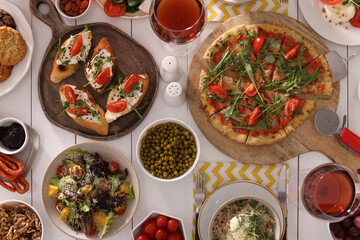 Many different dishes served on buffet table for brunch, flat lay