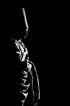 Sufism - An artistic black and white silhouette portrait of a Sufi dancer