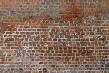 Red old brick wall background.