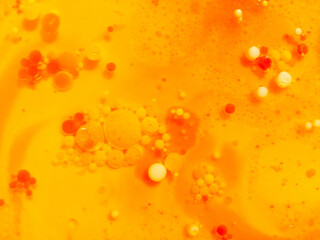 Abstract yellow, orange water bubbles background. .Full frame of the textures formed by the bubbles...