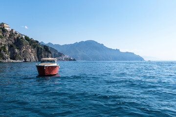 Panoramic view of beautiful Amalfi coast with boat, Italy.