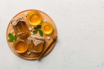 honey jar with acacia flowers and leaves. fresh honey top view flat lay