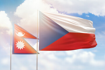 Sunny blue sky and flags of czechia and nepal