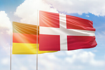 Sunny blue sky and flags of denmark and germany