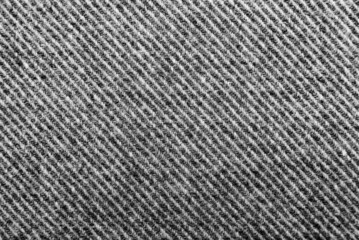 The texture of the fabric is black with straight white stripes. Material for tailoring