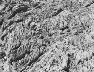 mountains in a hot country. steep descent from the mountain of sand and stone. Paths for tourists are trodden on the mountain. leisure. gray stones