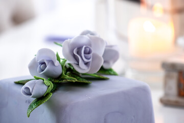 Beautiful decorated fruit cake with blue roses