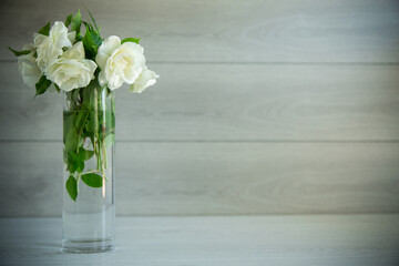 bouquet of beautiful white roses on table