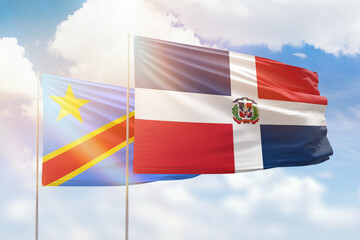 Sunny blue sky and flags of dominican republic and dr congo