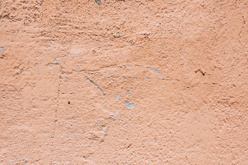 Background, texture of a cracked, stained beige wall.