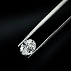 Oval shape diamond with tweezers