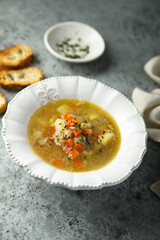 Homemade vegetable soup with smoked bacon