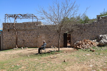 A man sitting alone in the house