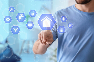 Man using application of smart home automation in room