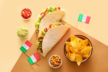 Composition with Mexican traditional food and flags on beige background