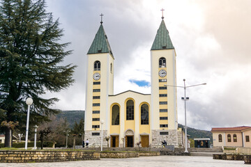 An exterior Photograph of the St. James Church, with clouds.