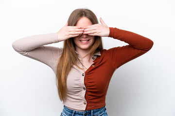 Young caucasian woman isolated on white background covering eyes by hands and smiling