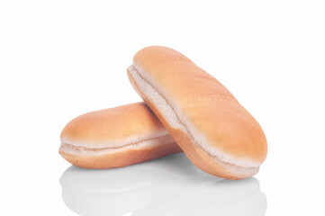 two hot dog buns lie on top of each other on a white background