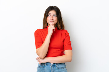 Young caucasian woman isolated on white background having doubts and thinking