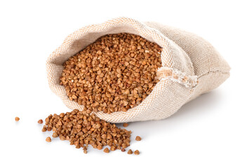Cloth bag with buckwheat grains on white background