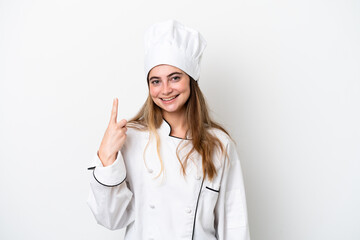 Young caucasian chef woman isolated on white background showing and lifting a finger in sign of the best