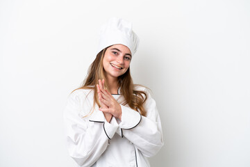 Young caucasian chef woman isolated on white background applauding after presentation in a conference