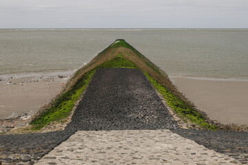 Spur Dike With Green Moss And Algae On Baltrum Island Frisia Germany On An Overcast Spring Day
