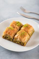 Pistachio baklava on a white plate
