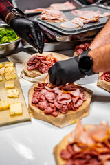 Chef hand is in process of Preparing catering food