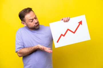 Middle age caucasian man isolated on yellow background holding a sign with a growing statistics...