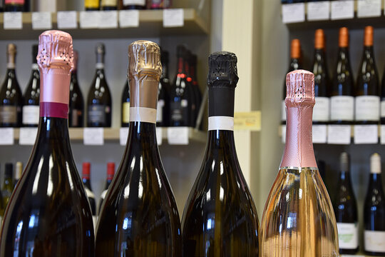 Sparkling wine bottles in wine store and ready for home delivery, restaurant, cafe, bar