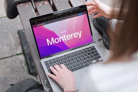England, Newcastle, June 10, 2022: The logo of the new OS Monterey on the MacBook screen. New operating system Apple 2022. Banner with a laptop on a new operating system.